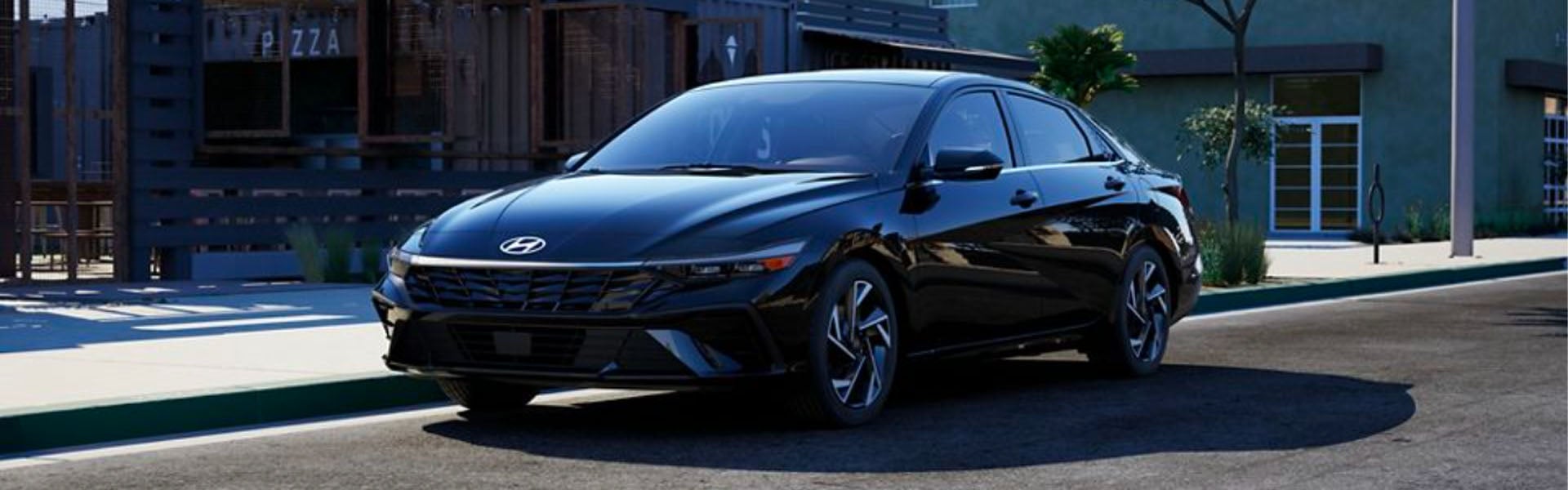 Black Hyundai Elantra parked on the street during the day